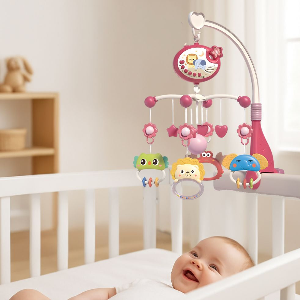 mobile musical bebe rose enfant souriant dans berceau