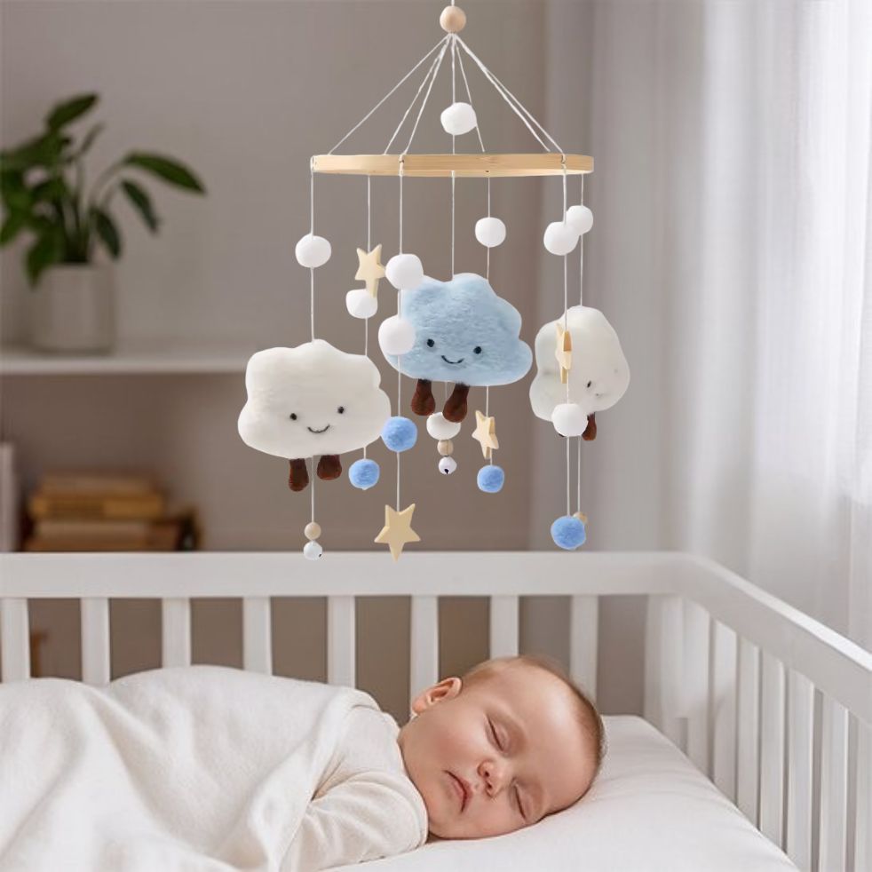 mobile bebe etoile bleu blanc bebe endormi dans berceau