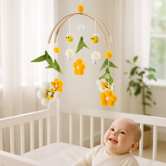 mobile bebe fleur abeille enfant souriant dans berceau