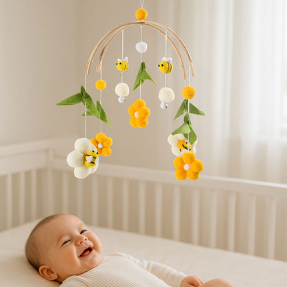 mobile bebe fleur abeille enfant souriant