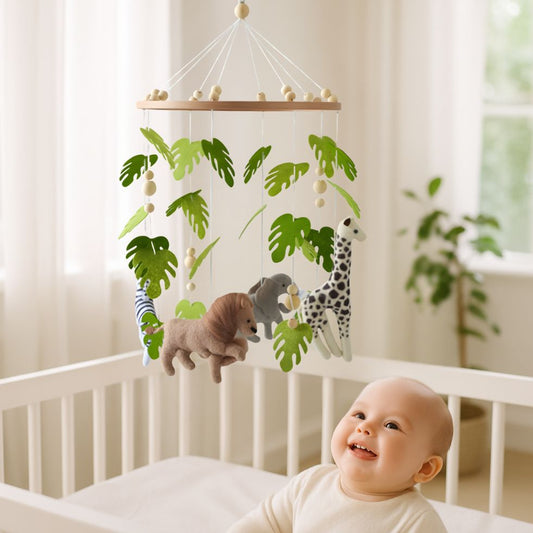 mobile bebe lion elephant girafe bebe souriant dans berceau