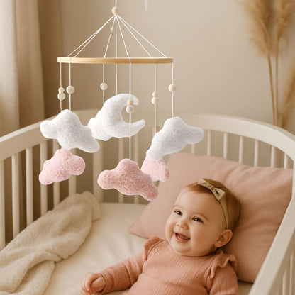 mobile bebe nuage rose blanc sensoriel fille souriante