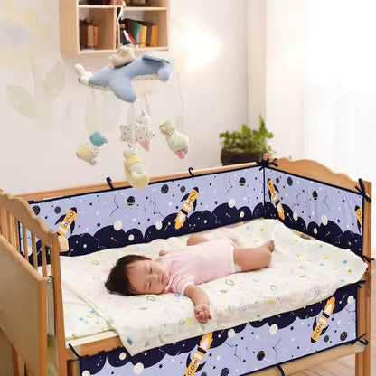 tour de lit gris bleu enfant endormi dans berceau